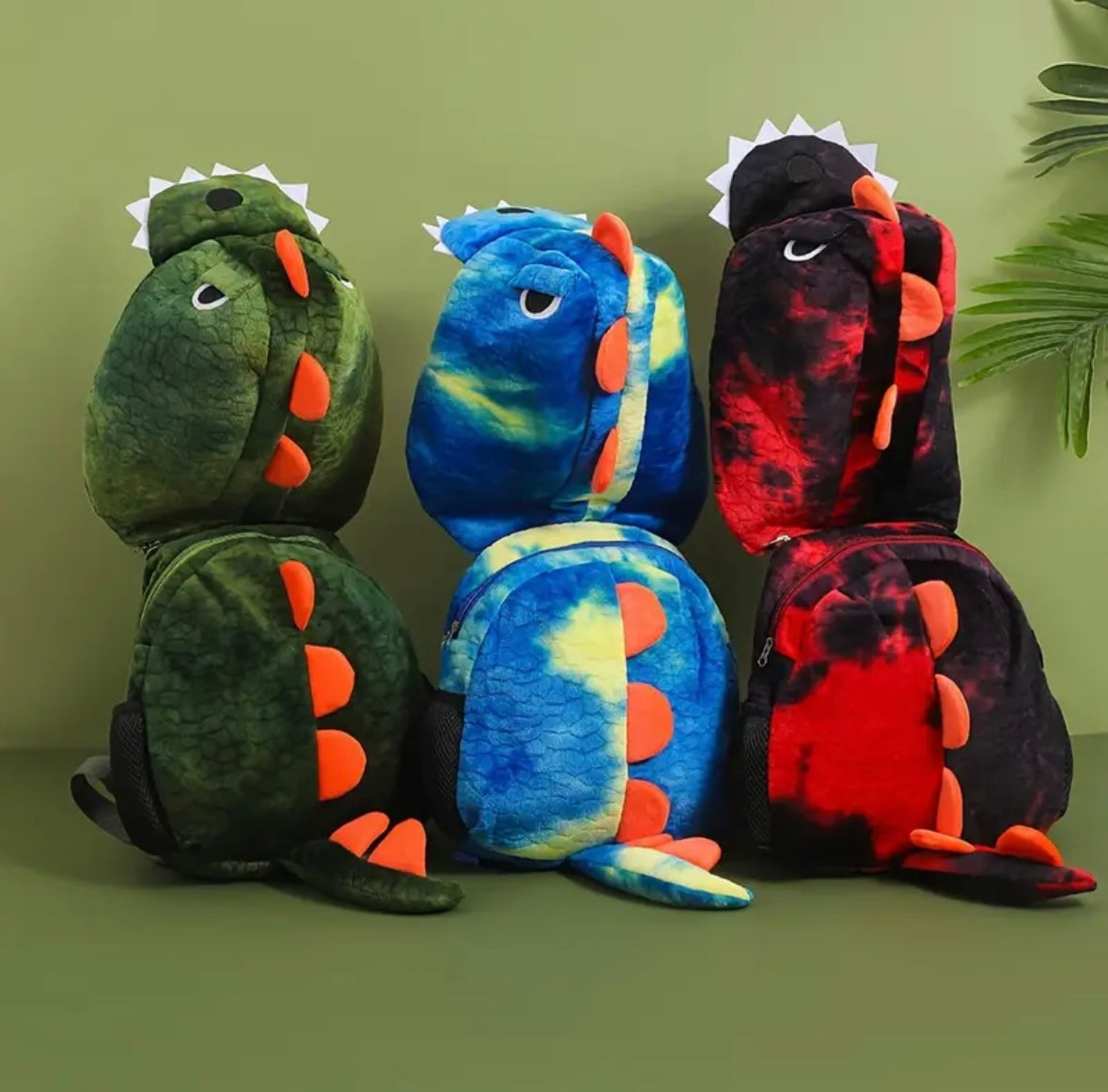 Mochila de peluche con capucha de dinosaurio